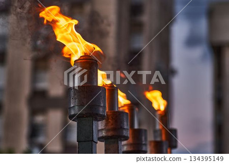 Hanukkah candles burning on menorah during Jewish holiday celebration 134395149