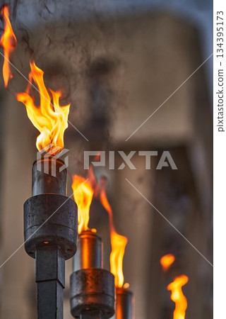 Hanukkah candles burning on menorah during Jewish holiday celebration Hanukkah candles burning on menorah during Jewish holiday celebration 134395173