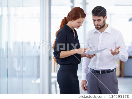 Business people, documents and planning for corporate finance in meeting or teamwork at the office. Businessman and woman discussing paperwork in collaboration, financial management or company budget Business people, documents and planning for corporate finance in meeting or teamwork at the office. Businessman and woman discussing paperwork in collaboration, financial management or company budget 134395178