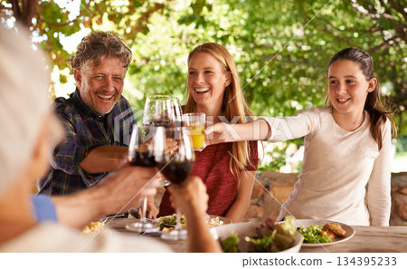 Family, group and wine glass for toast at table for celebration, food or friends at lunch event. Men, women or smile together to celebrate with alcohol, glasses or solidarity at party, dinner or home 134395233