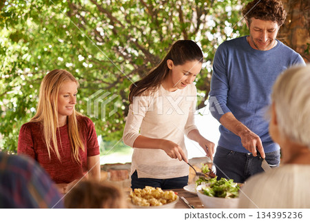 Food, party and lunch with family in nature and serving for health, bonding and celebration. Vacation, social and event with parents and children eating together for dining, generations and wellness 134395236