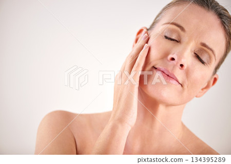 Senior woman, face and cosmetic wellness or touching her perfect skin on isolated and white background. Mature lady, massaging and wrinkles in facial aging process or skincare and beauty on mock up Senior woman, face and cosmetic wellness or touching her perfect skin on isolated and white background. Mature lady, massaging and wrinkles in facial aging process or skincare and beauty on mock up 134395289