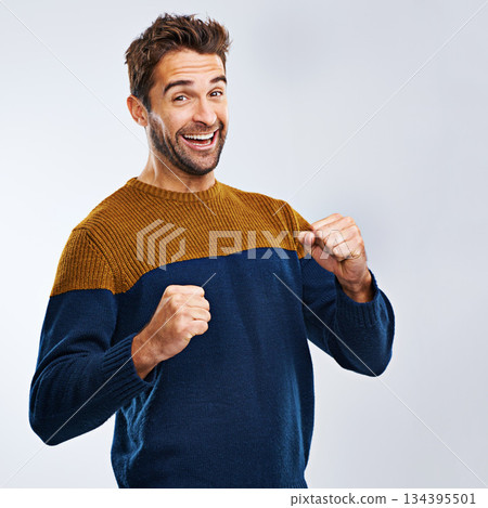 Portrait, winner and man with energy, fist and excitement with guy isolated against a studio background. Face, male person and model winning, goals and happiness with victory, wow and omg with joy 134395501
