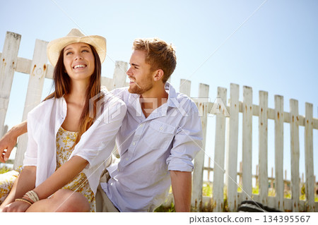 Nature, love and outdoor couple relax, happy and enjoy quality time together on lawn, grass field or picnic mockup. Park fence mock up, sky and people bond on summer holiday in Portugal countryside Nature, love and outdoor couple relax, happy and enjoy quality time together on lawn, grass field or picnic mockup. Park fence mock up, sky and people bond on summer holiday in Portugal countryside 134395567