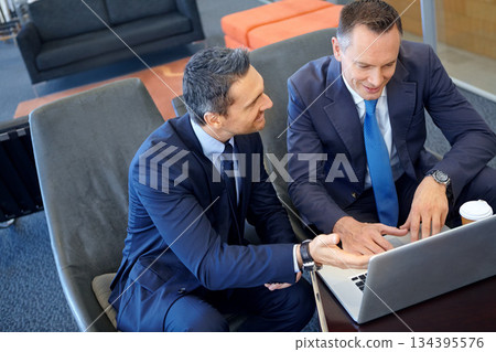 Teamwork, corporate or business men with laptop planning company growth, ideas and research in top view. Team, happy or corporate employee in office lounge for collaboration, search web or meeting Teamwork, corporate or business men with laptop planning company growth, ideas and research in top view. Team, happy or corporate employee in office lounge for collaboration, search web or meeting 134395576