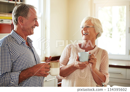 Funny, coffee or old couple laughing in kitchen at home bonding or enjoying quality time together. Happy retirement, morning or senior man talking, relaxing or drinking tea espresso with mature woman Funny, coffee or old couple laughing in kitchen at home bonding or enjoying quality time together. Happy retirement, morning or senior man talking, relaxing or drinking tea espresso with mature woman 134395602