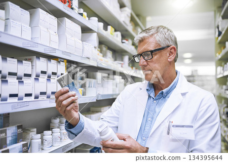 Pharmacy, medicine and search with man in store for label reading, inspection and inventory. Medical, healthcare and pills with mature male pharmacist in clinic for expert, wellness and product check 134395644