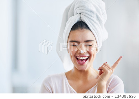 Happy woman, head towel and cream on nose for cosmetics, beauty and dermatology. Female person, face and laughing with facial lotion after shower for healthy shine, glow or aesthetic skincare at home Happy woman, head towel and cream on nose for cosmetics, beauty and dermatology. Female person, face and laughing with facial lotion after shower for healthy shine, glow or aesthetic skincare at home 134395656
