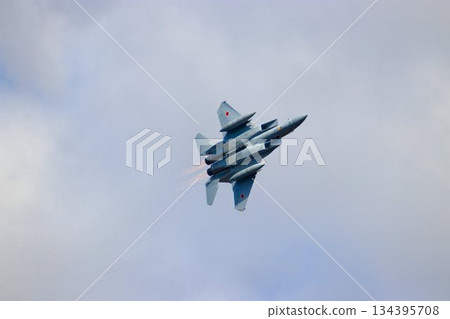 F-15J maneuvering over the Hyakuri Air Base with its rear banner fully open 134395708