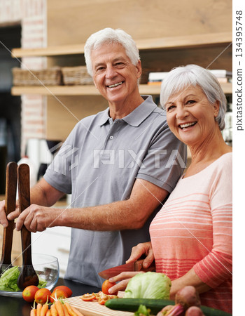 Cooking, salad and portrait of old couple in kitchen for health, love and nutrition. Happy, smile and retirement with senior man and woman cutting vegetables at home for food, dinner and recipe Cooking, salad and portrait of old couple in kitchen for health, love and nutrition. Happy, smile and retirement with senior man and woman cutting vegetables at home for food, dinner and recipe 134395748
