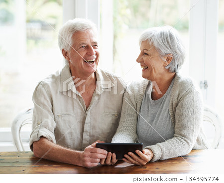 Tablet, senior couple and laughing in home on social media, funny news and online meme. Happy old man, woman and relax with digital technology, subscription and streaming comedy on network connection Tablet, senior couple and laughing in home on social media, funny news and online meme. Happy old man, woman and relax with digital technology, subscription and streaming comedy on network connection 134395774