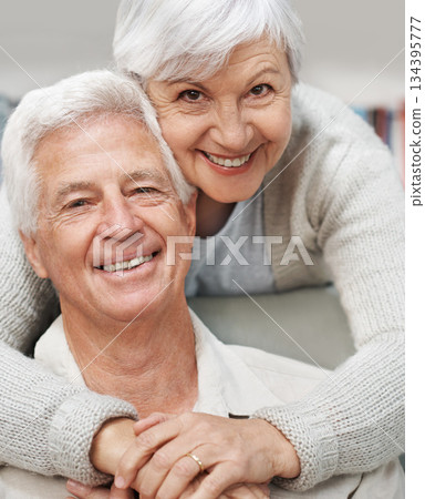 Senior, happy couple and portrait smile with hug for love, romance or embrace in relationship or marriage at home. Elderly woman face hugging man smiling for care or bonding together in retirement 134395777