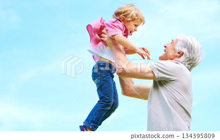 Happy, lifting and fun with grandfather and grandson for bonding, affectionate and free time space. Happiness, smile and playing with old man and young boy for family, generations and blue sky mockup Happy, lifting and fun with grandfather and grandson for bonding, affectionate and free time space. Happiness, smile and playing with old man and young boy for family, generations and blue sky mockup 134395809