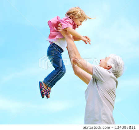 Fun, lifting and playful with grandfather and grandson for bonding, affectionate and free time. Love, smile and playing with old man and boy for family and generations on blue sky mockup space 134395811