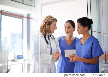 Planning, woman doctor and nurses with digital tablet or healthcare support or wellness analysis and in hospital. Team, diagnosis and health care specialists or medical results to save lives Planning, woman doctor and nurses with digital tablet or healthcare support or wellness analysis and in hospital. Team, diagnosis and health care specialists or medical results to save lives 134395824