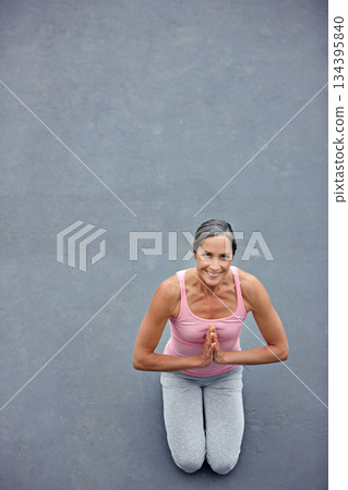 Mockup, yoga and portrait of old woman with praying hands on floor for meditation, healing and balance from above. Mindfulness, prayer pose and space for elderly lady meditating for zen or wellness Mockup, yoga and portrait of old woman with praying hands on floor for meditation, healing and balance from above. Mindfulness, prayer pose and space for elderly lady meditating for zen or wellness 134395840