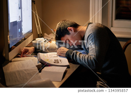Young student, books and sleeping near screen or studying late into the night or resting on table and reading for examination. Tired, research and hard working for test paper or computer at home Young student, books and sleeping near screen or studying late into the night or resting on table and reading for examination. Tired, research and hard working for test paper or computer at home 134395857