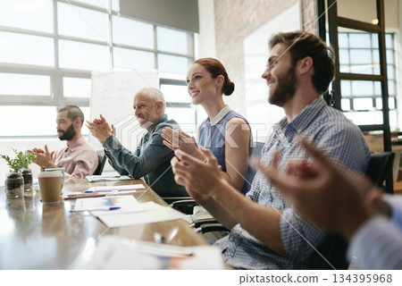 Meeting, success and applause with a business team in the boardroom in celebration of a target or goal. Collaboration, teamwork and support with a group of employee colleagues clapping in the office 134395968