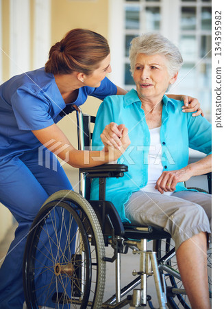Communication, caregiver or old woman in a wheelchair in hospital helping an elderly patient for support. Speaking, disabled or healthcare social worker talking to a senior person with a disability Communication, caregiver or old woman in a wheelchair in hospital helping an elderly patient for support. Speaking, disabled or healthcare social worker talking to a senior person with a disability 134395982