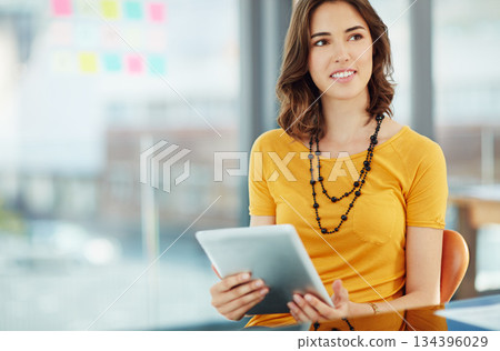Business woman is thinking with tablet in office, ideas and inspiration for project with focus at digital marketing agency. Creative female designer, think of content for website and tech with mockup Business woman is thinking with tablet in office, ideas and inspiration for project with focus at digital marketing agency. Creative female designer, think of content for website and tech with mockup 134396029