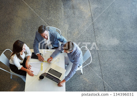 Top view, business and team planning, technology and teamwork in the workplace, collaboration and brainstorming. Group, coworkers and employees share ideas, laptop and meeting for a new project 134396031