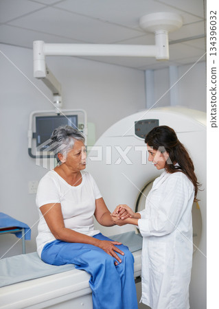 Doctor, mri and woman holding hands of patient in hospital before scanning in machine. Ct scan, comfort or medical professional with senior female person in radiology test for healthcare consultation 134396032