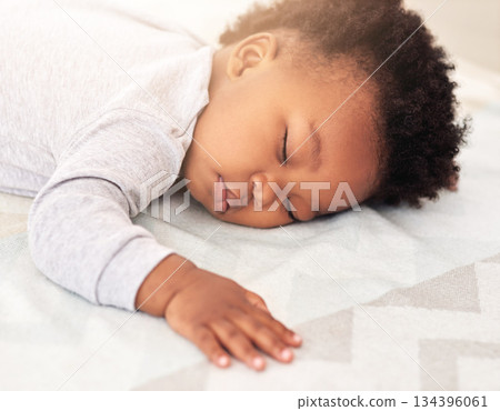 Baby, african boy and sleep in bedroom for rest, health and peace for growth, development and relax in family home. Black male infant, tired and sleeping on bed with fatigue, quiet and calm in house Baby, african boy and sleep in bedroom for rest, health and peace for growth, development and relax in family home. Black male infant, tired and sleeping on bed with fatigue, quiet and calm in house 134396061