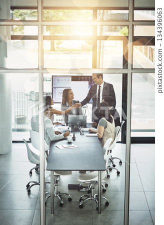 Business meeting, partnership and b2b handshake in office for partnership, trust and startup deal. Businessman, shaking hands and team in a boardroom for synergy, integration and thank you gesture 134396063