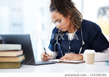 Medical student, thinking or writing books in research education, wellness studying or hospital learning. Laptop, nurse or healthcare woman and notebook, technology or scholarship medicine internship 134396166