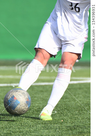 Soccer player who kicks the ball 134396931