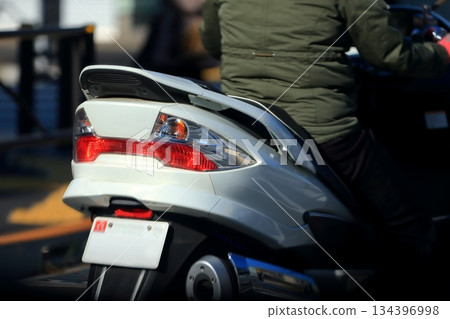 Image of a big scooter's taillight 134396998