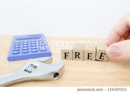Photos of tools and free blocks indicating free construction costs and free estimates. Photos of tools and free blocks indicating free construction costs and free estimates. 134397031