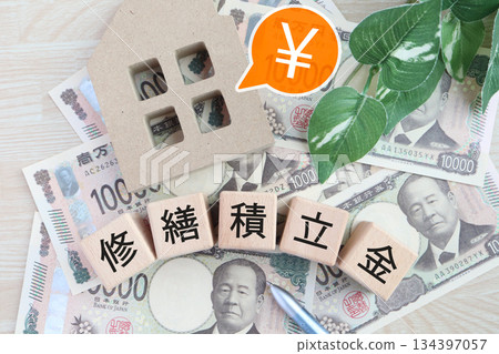 A model of a house and an image of Japanese yen showing the repair reserve fund. 134397057