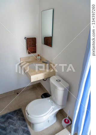 modern bathroom with blue shower curtain and white decor modern bathroom with blue shower curtain and white decor 134397260