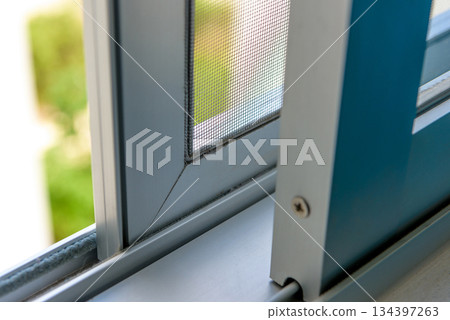 open aluminum window with natural light interior detail 134397263