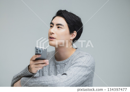 Young man wearing knitwear Young man wearing knitwear 134397477