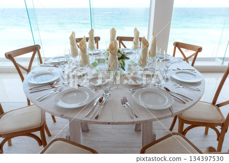 elegant banquet tables prepared for a conference or a party indoors elegant banquet tables prepared for a conference or a party indoors 134397530