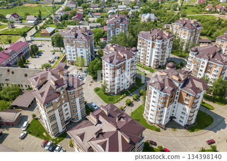 Top view of apartment or office tall buildings, parked cars, urban city landscape. Drone aerial photography. 134398140