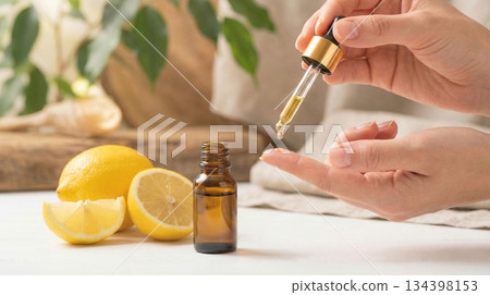 woman applying serum vitamin c on her skin face 134398153