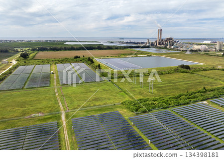 Solar energy replacing fossil fuel power at Big Bend Power Station near Tampa, Florida. Clean electricity production through photovoltaic panels in a large-scale utility setup Solar energy replacing fossil fuel power at Big Bend Power Station near Tampa, Florida. Clean electricity production through photovoltaic panels in a large-scale utility setup 134398181
