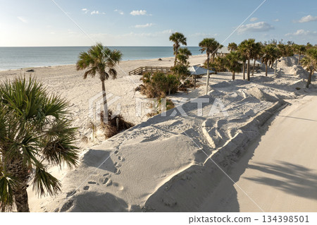 Piles of debris on street side after hurricane Milton on Manasota key road in Florida. Trash from severely damaged houses after storm surge. Consequences of natural disaster 134398501