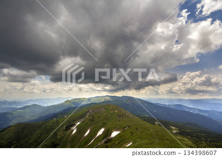 Mountain ridge landscape under dramatic cloudy sky, summer or spring wide panoramic view. Mountain ridge landscape under dramatic cloudy sky, summer or spring wide panoramic view. 134398607
