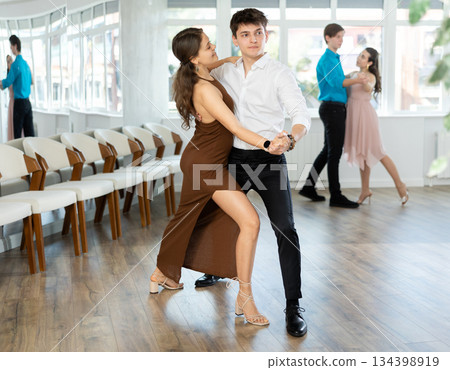 Couple young woman and man dancing latin dances 134398919