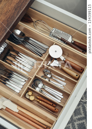 Bamboo organizer with cutlery in kitchen drawer Bamboo organizer with cutlery in kitchen drawer 134399115