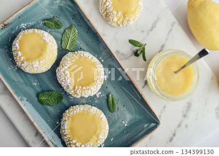Lemon crackle cookies with lemon curd Lemon crackle cookies with lemon curd 134399130