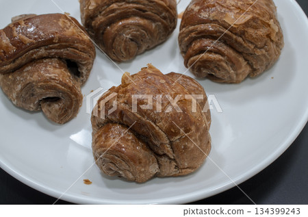 Eat chocolate mini croissants 134399243