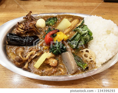 A delicious curry with plenty of fried vegetables and spices. A delicious curry with plenty of fried vegetables and spices. 134399293