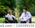 Doctor checking lung of elderly woman during homecare medical. 134399338