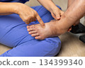 Elderly woman has edema or swelling foot. 134399340