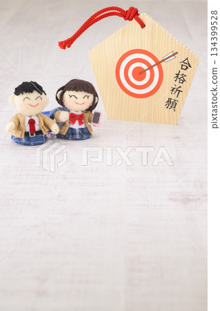 High school student dolls and votive plaques for praying for success in exams 134399528